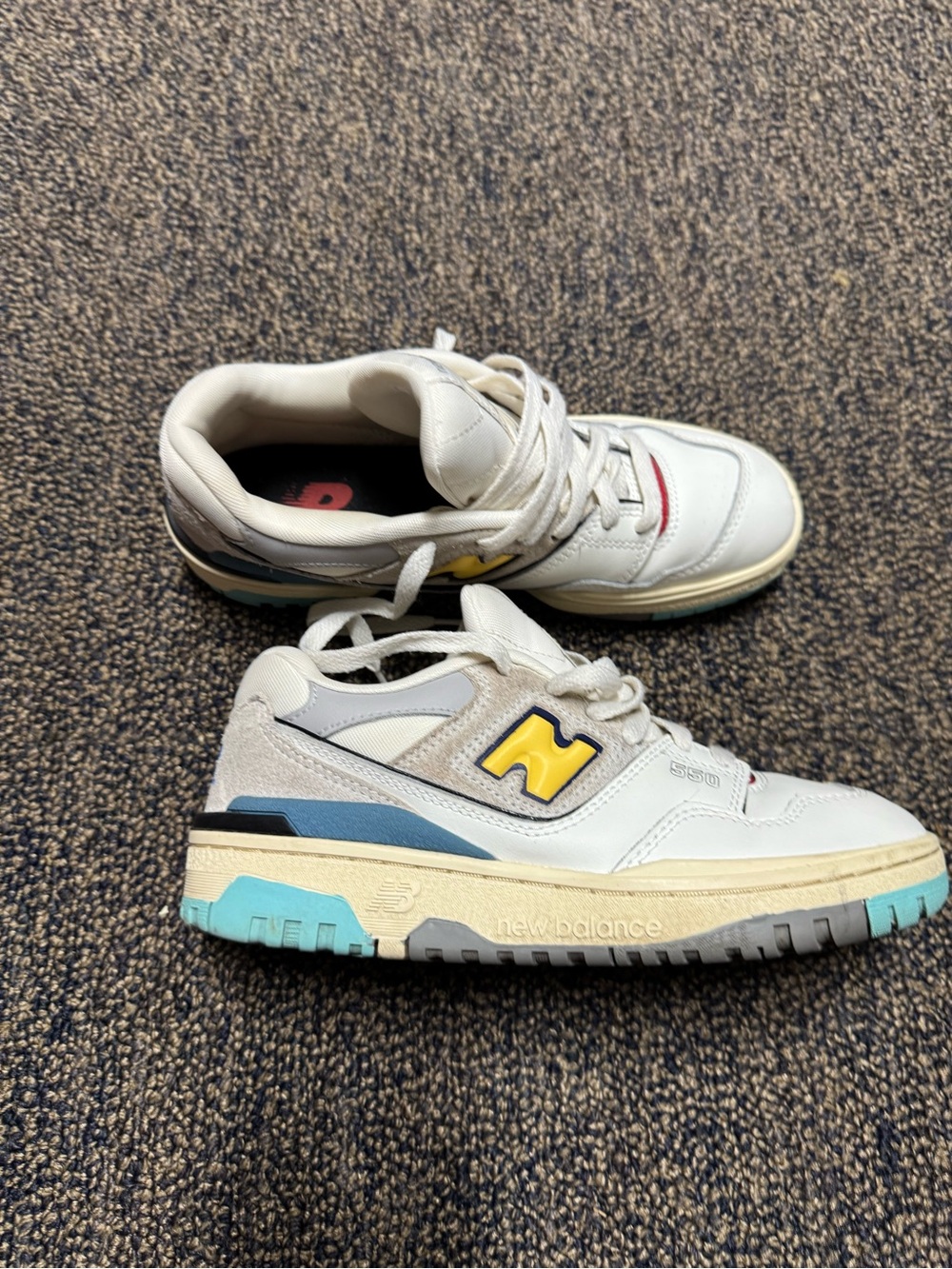 New Balance 550 White Sneakers with Yellow Logo and Blue Sole Accents